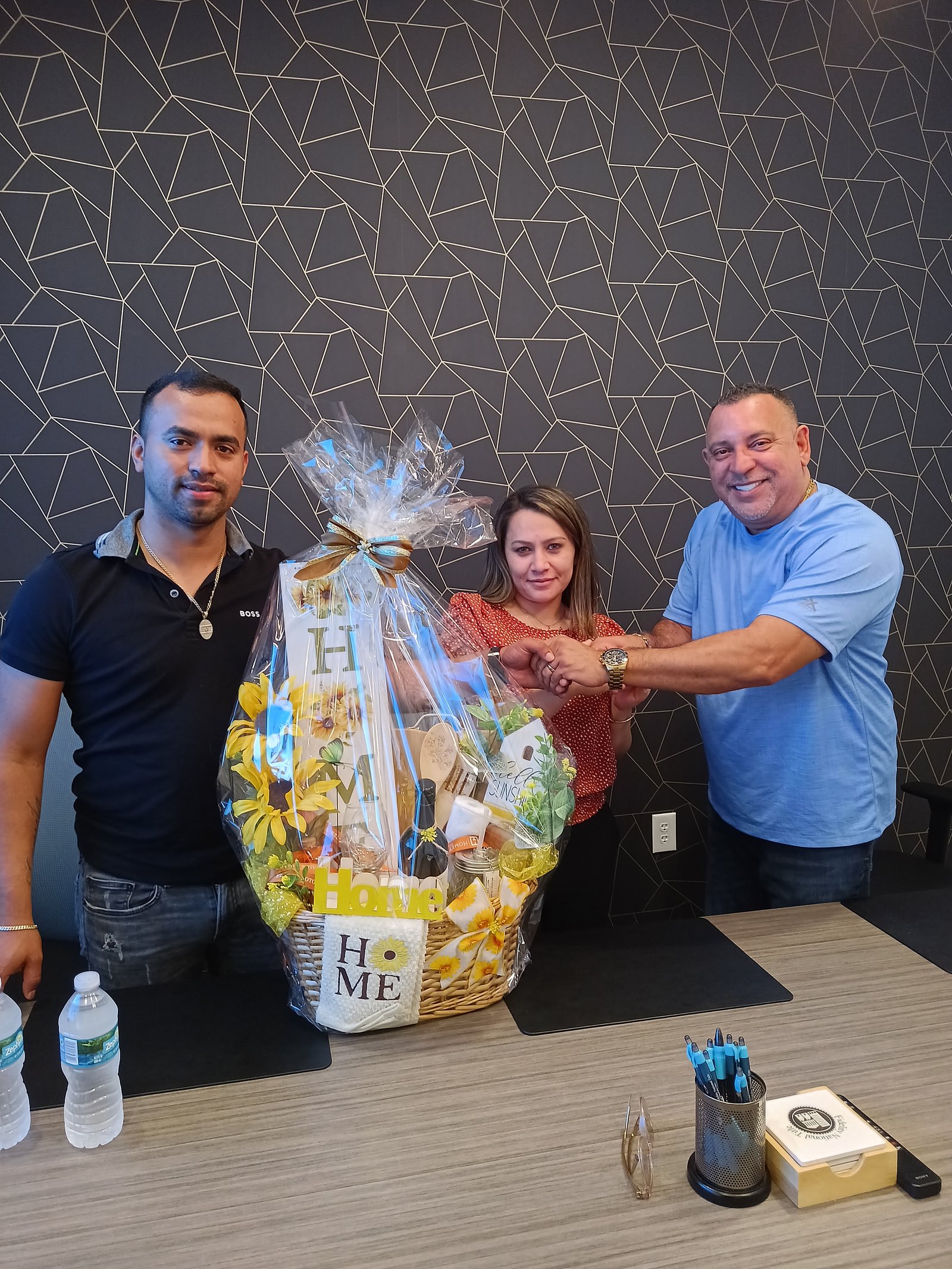Closing day celebration with clients and a housewarming gift basket